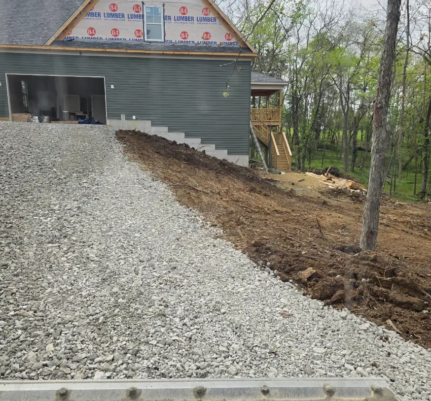 Gravel approach built up to a new garage