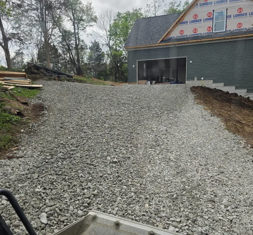 Gravel pad built up to a new home's garage