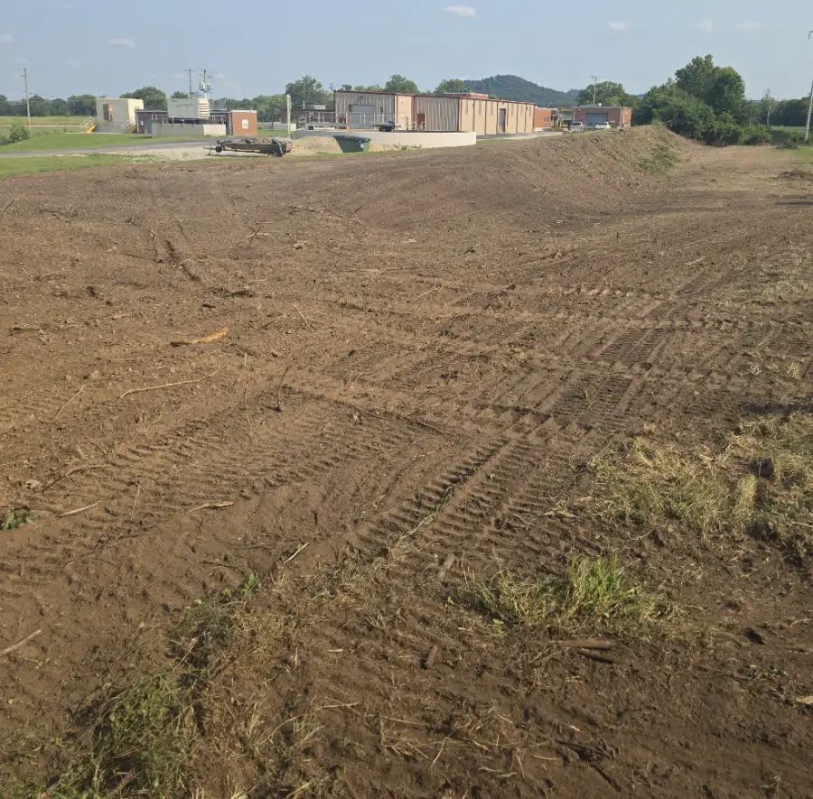 Large graded lot prepared for building near commercial buildings