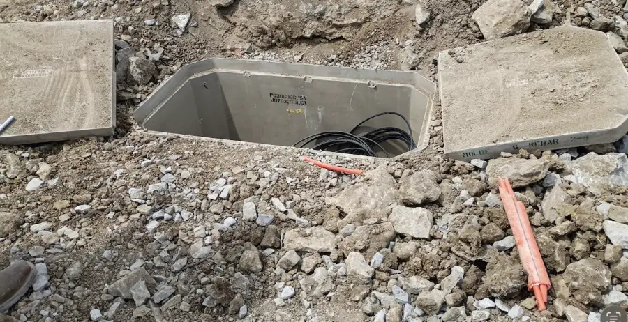 Concrete utility vault set in gravel